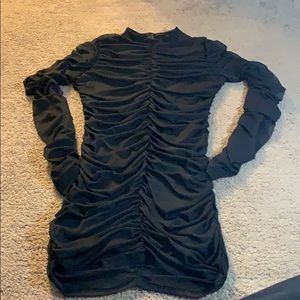 Black scrunched styled turtle neck dress